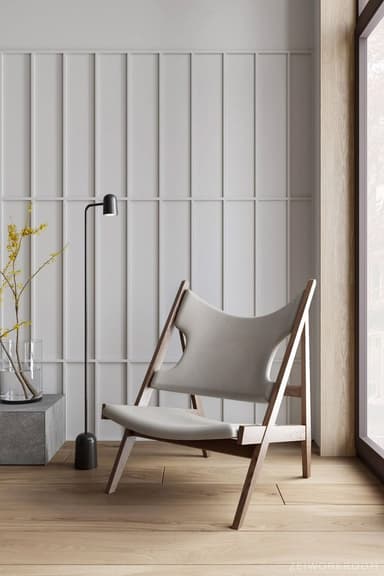 A low-slung lounge chair featuring a dark stained wooden A-frame structure and light grey synthetic leather sling seat and backrest, presenting a minimalist and contemporary aesthetic. — 3D model