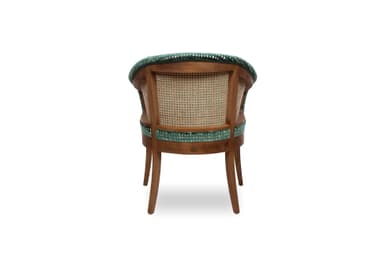 An upholstered armchair featuring a barrel-shaped back and integrated armrests, covered in a dark green velvet fabric with a textured, mottled pattern. The chair is supported by four solid wooden legs that are slightly tapered. — 3D model