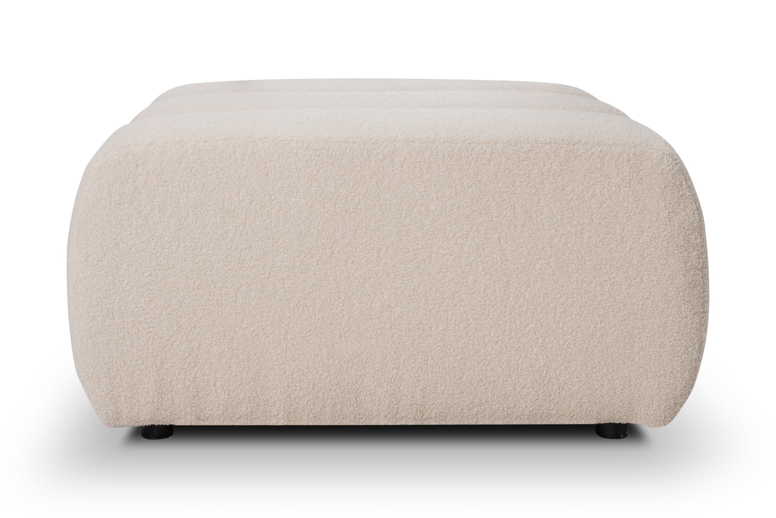 A rectangular ottoman with rounded edges.  The ottoman appears to be upholstered in a thick, plush, off-white or cream-colored fabric with a slightly textured surface, suggesting a bouclé or similar material.  Small, dark-colored feet are visible at the bottom. The overall shape is relatively low and wide. — 3D model