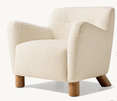 A contemporary armchair upholstered in cream-colored bouclé fabric, featuring a rounded silhouette, integrated arms, and wooden legs. — 3D model