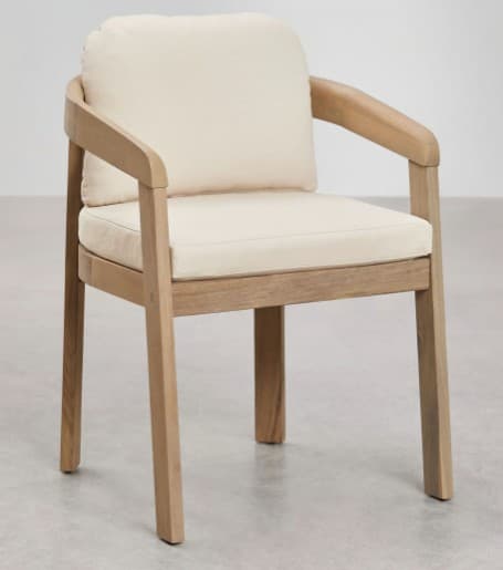 A contemporary armchair featuring a light-toned wooden frame with gently curved armrests and straight legs. The seat and backrest are fitted with thick, removable cream-colored fabric cushions. — 3D model