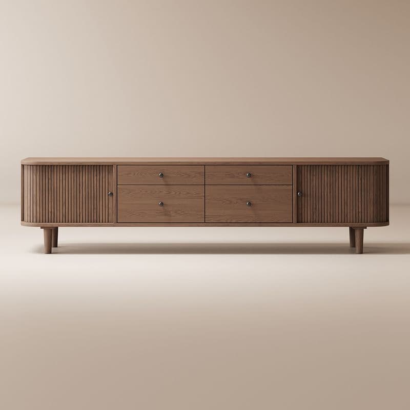 A long, low wooden sideboard featuring a fluted door on the left, four drawers in the center, and a fluted door on the right. It stands on four tapered legs. The wood has a natural grain and is finished in a light brown hue. Each drawer and door has a small, circular brass knob. The overall design is modern with a nod to mid-century aesthetics. — 3D model