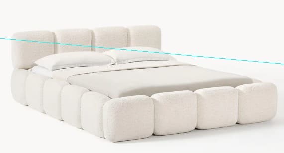 A plush, modern bed frame upholstered in a textured cream-colored fabric. The headboard and the base are composed of individual, rounded rectangular modules arranged in a repeating pattern. The bed is made with a mattress and pillows. — 3D model