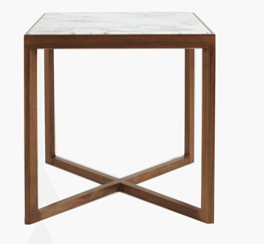 A modern end table featuring a rectangular white marble top with subtle grey veining, supported by a wooden base. The base consists of four square-sectioned legs connected by an X-shaped stretcher at the bottom, creating a minimalist and geometric design. — 3D model