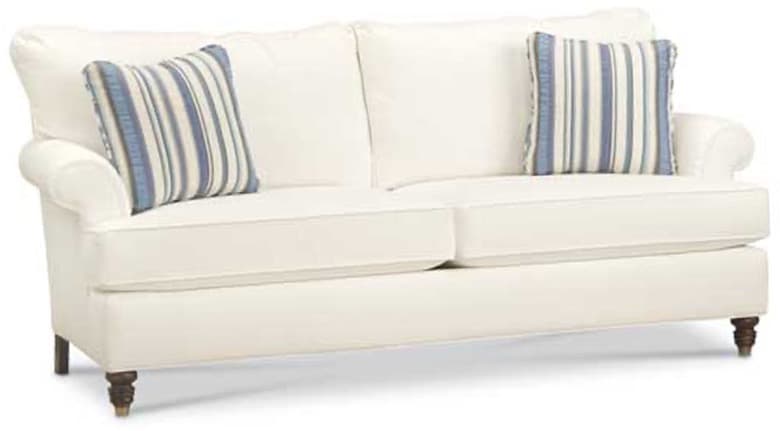 A cream-colored, upholstered sofa with two seat cushions and two back cushions. It features rolled arms and is supported by four wooden legs with a dark finish. Two decorative throw pillows with blue and white stripes are placed on the sofa. — 3D model