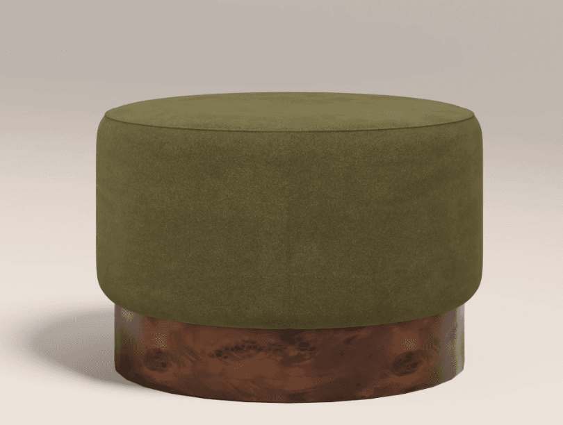 A cylindrical ottoman with a rounded top upholstered in a textured olive green fabric, set on a distinct base made of wood with a prominent burl grain pattern. — 3D model