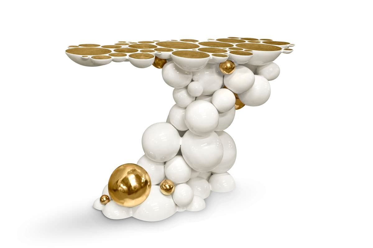 A highly decorative console table featuring a sculptural base composed of interconnected white and gold spheres, supporting a tabletop also made of golden-lined circular depressions. — 3D model