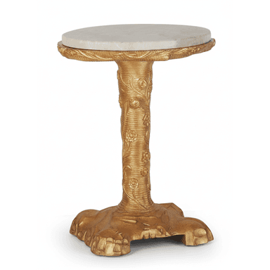 A small, round accent table featuring a circular white marble top and a highly decorative, intricately carved gilded base. The central pedestal and three-lobed base are adorned with floral and leaf motifs, finished in a shimmering gold. — 3D model (AI enhanced source)