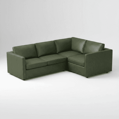 An L-shaped sectional sofa upholstered in a rich green leather or faux leather, featuring a contemporary design with clean lines and square arms. — 3D model (AI enhanced source)