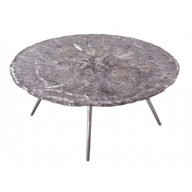 A circular coffee table with a dark, textured top featuring embedded organic or decorative elements. It is supported by three slender, metallic legs. — 3D model (AI enhanced source)