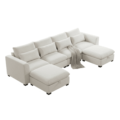 A contemporary modular U-shaped sectional sofa with six seating components, including two end sections with arms and two storage ottomans at the ends. The sofa is upholstered in a light, neutral fabric, likely linen or a similar textile, and features plush seat and back cushions. A grey throw blanket is draped over one section. — 3D model (AI enhanced source)