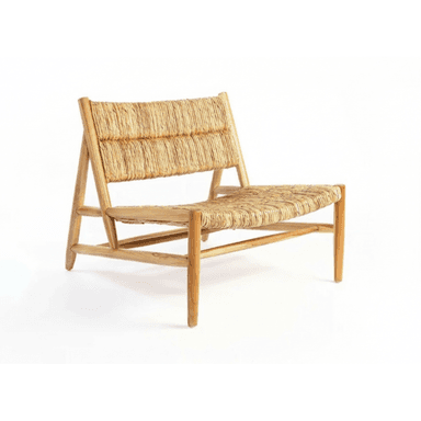 A low-profile lounge chair featuring a natural wood frame and a tightly woven rush or seagrass seat and backrest. — 3D model (AI enhanced source)