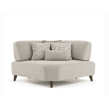 A contemporary corner armchair upholstered in a light-colored textured fabric. It features a low profile, clean lines, and angled arms. The seat and back are upholstered, and it is supported by four dark wooden tapered legs. Three decorative throw pillows with patterned covers are arranged on the seat. — 3D model (AI enhanced source)