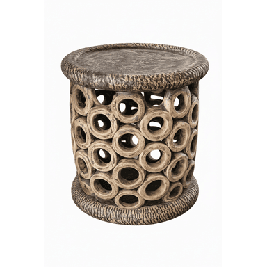 A cylindrical, handcrafted accent table or stool featuring an intricate, openwork body composed of numerous interconnected circular elements. The top surface and base are finished with a deeply textured, organic ripple pattern. — 3D model (AI enhanced source)