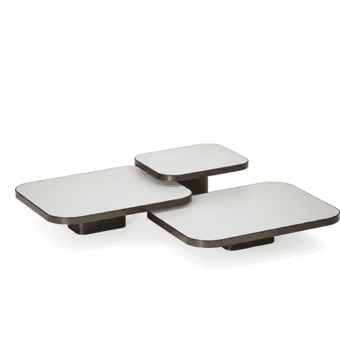 A modern multi-tiered coffee table featuring three distinct rectangular platforms with rounded corners. Each platform has a white top surface and dark bronze-toned edges and a low, rectangular base. The platforms are arranged in an overlapping, offset configuration, suggesting a potential swivel or modular adjustment capability. — 3D model (AI enhanced source)