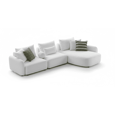 An L-shaped sectional sofa in a white, textured fabric, consisting of multiple modular components, including a chaise lounge end. The sofa features plush, rounded cushions and backrests, accompanied by several matching white throw pillows and three green patterned accent pillows. The design is low-profile and contemporary. — 3D model (AI enhanced source)