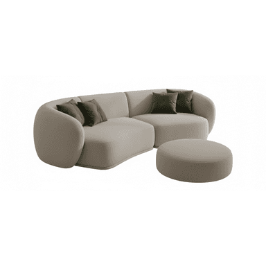 A modern, curved sectional sofa upholstered in a light beige fabric, accompanied by a matching round ottoman. It features soft, rounded lines and includes two dark green throw pillows. — 3D model (AI enhanced source)