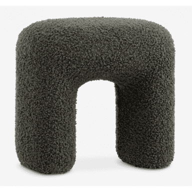 A contemporary U-shaped stool upholstered in a dark green boucle fabric. The stool features soft, rounded edges and a sculptural form, providing both a unique aesthetic and comfortable seating. Its entire surface is covered in the textured, looped yarn fabric. — 3D model (AI enhanced source)