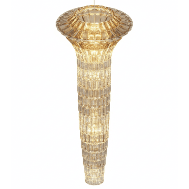 A large, tiered chandelier composed of numerous faceted amber-toned crystal or glass elements, forming an elongated, columnar shape. It features a wider, ornate top section from which the descending, tapering body is suspended. The internal light sources illuminate the faceted surfaces, creating a warm, sparkling glow. — 3D model (AI enhanced source)