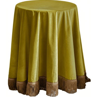 A round table completely covered by a floor-length, olive green velvet tablecloth. The tablecloth features a decorative fringe trim in a contrasting brown color along its bottom edge. The velvet fabric displays a soft sheen and drapes in gentle folds around the table, obscuring the base. The fringe is segmented by a patterned band just above the tassels. — 3D model (AI enhanced source)