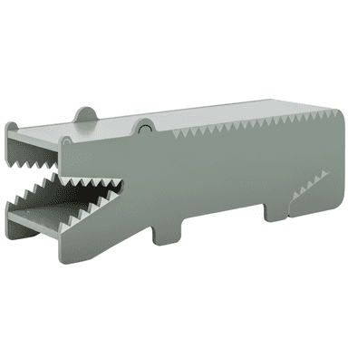 A children's storage unit designed in the shape of a crocodile, rendered in a muted green-gray finish. The unit features an open 'mouth' with two internal shelves, mimicking teeth with serrated edges. Decorative details include small eyes and scales along the back, contributing to its playful, animal-inspired aesthetic. It is likely constructed from painted wood or MDF. — 3D model (AI enhanced source)