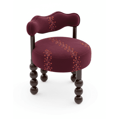 A compact, upholstered decorative accent chair featuring a distinctive burgundy velvet-like fabric. The chair has a rounded, plush seat and a low, scalloped backrest that integrates subtle arm supports. Both the seat and backrest are adorned with an embroidered pattern depicting berry branches in shades of orange, red, and gold. The chair stands on four dark brown, lacquered wooden legs, each composed of a series of stacked spherical elements, commonly known as bobbin or spool legs. — 3D model (AI enhanced source)
