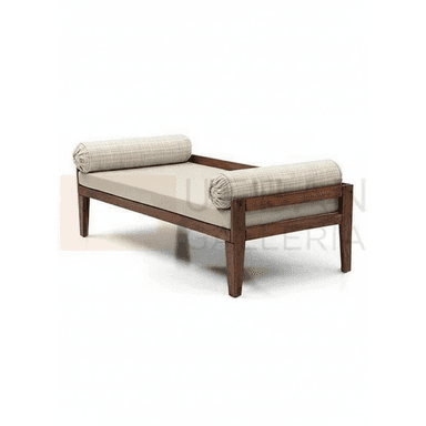A contemporary daybed featuring a dark-stained solid wood frame, a light beige main cushion, and two patterned cylindrical bolster pillows at either end. The frame has clean lines and sturdy, tapered legs. — 3D model (AI enhanced source)