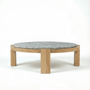 A modern round coffee table featuring a solid oak wood base and a thick, circular grey marble top. The wooden base consists of a circular frame supported by sturdy, rectangular legs. The marble top is recessed into the wooden frame, creating a flush or slightly raised surface. The overall design is minimalist and contemporary. — 3D model (AI enhanced source)