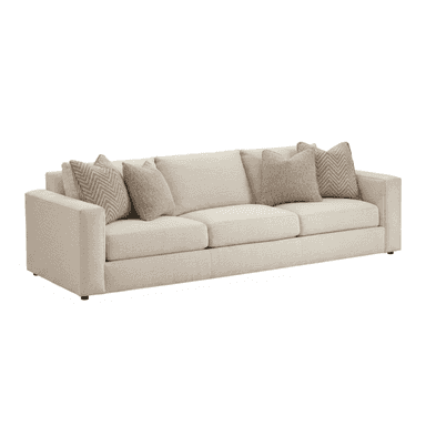 A contemporary three-seater sofa with track arms, upholstered in a light beige, textured fabric. It features three loose seat cushions, three loose back cushions, and four accent throw pillows in complementary neutral tones and patterns. — 3D model (AI enhanced source)