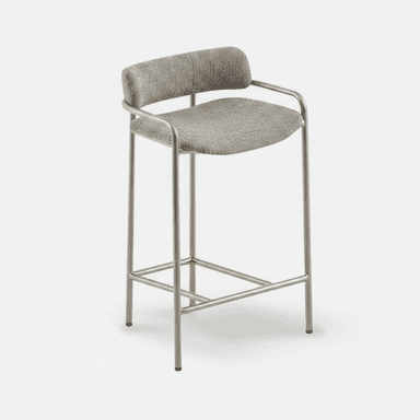 A contemporary bar stool featuring a slender tubular metal frame, upholstered seat, and a curved backrest that seamlessly extends into armrests. The stool includes a built-in footrest and sits on four straight legs. — 3D model (AI enhanced source)