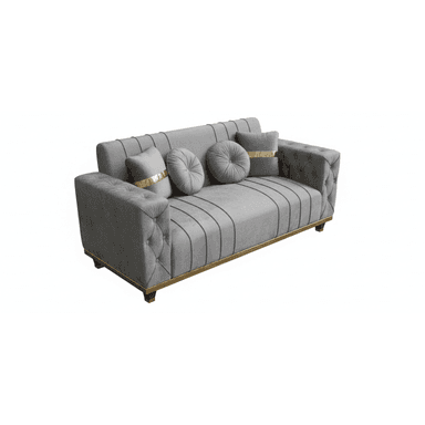 A contemporary grey velvet sofa featuring distinct channel tufting on the seat back and along the front base, complemented by button tufting on the exterior arms. The sofa is accented with a polished gold-finished trim that runs along the bottom edge, just above its dark wooden feet, which are also capped with gold accents. It includes four decorative throw pillows: two square pillows with a prominent gold fabric band, and two round, button-tufted pillows. — 3D model (AI enhanced source)