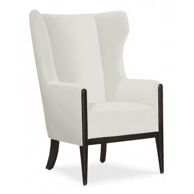 A modern wingback armchair featuring an exposed dark wood frame and light-colored fabric upholstery. The chair has a tall, structured back with subtle wings that extend forward, providing a sense of enclosure. The arms are gently curved, with the wood frame extending upwards to form the armrests before transitioning into the upholstered back. Tapered cylindrical legs support the chair, and the overall design combines traditional wingback elements with a contemporary aesthetic. — 3D model (AI enhanced source)