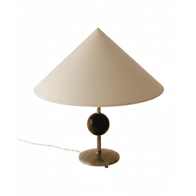 A refined table lamp featuring a wide, cream-colored conical shade. The lamp's stem connects to a dark, spherical accent, likely ebonized wood, which sits atop a cylindrical support that transitions into a circular brass base. A braided electrical cord extends from the base. — 3D model (AI enhanced source)