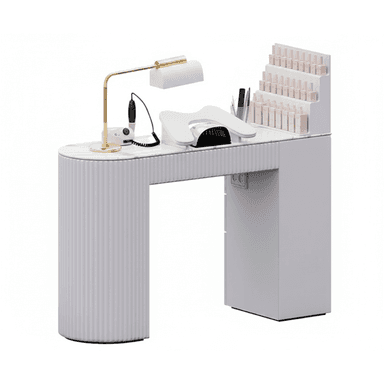 A modern manicure station featuring a white and light grey finish with a faux marble tabletop. The desk is supported by a curved, fluted leg on the left and a rectangular cabinet-style leg on the right, which incorporates an integrated nail polish display rack. It is equipped with a gold-finished task lamp, a nail drill, and a UV curing lamp, making it a complete setup for professional nail services. — 3D model (AI enhanced source)