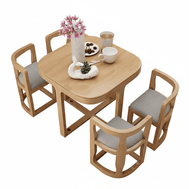 A compact modern dining set featuring a square wooden table with rounded corners and four matching chairs, each with a grey upholstered seat. The table has a distinctive X-shaped base for stability. The chairs feature curved, open-frame backs and integrated armrests, designed for small spaces. — 3D model (AI enhanced source)