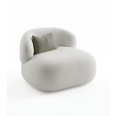 A single-seater armchair with a rounded, organic silhouette. The upholstery appears to be a textured boucle fabric, providing a soft and inviting aesthetic. It features a low profile and a generously proportioned seat and backrest. A rectangular throw pillow in a muted green hue is placed against the backrest. — 3D model (AI enhanced source)