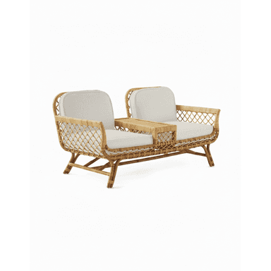 A contemporary loveseat crafted from natural rattan, featuring a woven open-patterned frame. It includes two seating areas with thick, light-colored fabric cushions, separated by a rectangular integrated table section made of solid rattan. The frame showcases curved lines and sturdy legs, presenting a light and airy aesthetic suitable for various relaxed settings. — 3D model (AI enhanced source)