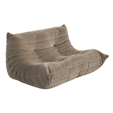 A two-seater Togo sofa, upholstered in a taupe velvet fabric, featuring its characteristic pleated and deeply tufted design, creating a distinctive relaxed and slouchy aesthetic. The all-foam construction is visible through the soft, contoured lines. — 3D model (AI enhanced source)