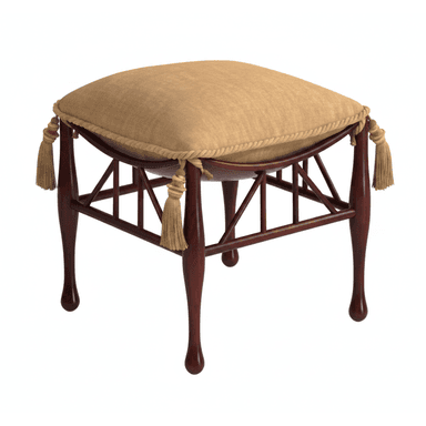 A square, upholstered ottoman with a dark wood frame featuring turned legs and a tan fabric cushion adorned with decorative rope trim and tassels. — 3D model (AI enhanced source)