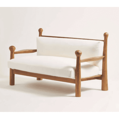 A wooden loveseat featuring a solid wood frame with distinctive turned posts at each corner, topped with spherical finials. It includes thick, removable seat and back cushions upholstered in white fabric. The armrests are open slats, and the entire piece rests on sturdy, straight legs. — 3D model (AI enhanced source)