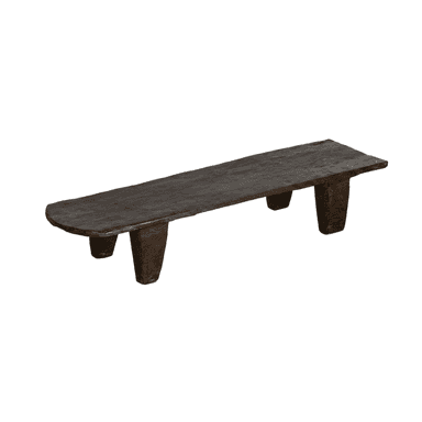 A rustic, dark wooden bench featuring an elongated, flat top and four sturdy, tapered legs. The material appears to be solid, roughly carved wood with a deeply aged or stained dark brown finish, presenting an organic and primitive aesthetic. — 3D model (AI enhanced source)