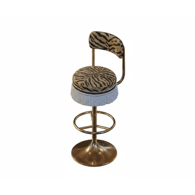 A high-backed swivel bar stool featuring a circular seat and curved backrest upholstered in a distinctive tiger print fabric. The seat edge is adorned with a white or silver fringe. The stool is supported by a polished brass-finished pedestal base with a trumpet-shaped bottom and a circular footrest, allowing for swivel functionality. — 3D model (AI enhanced source)