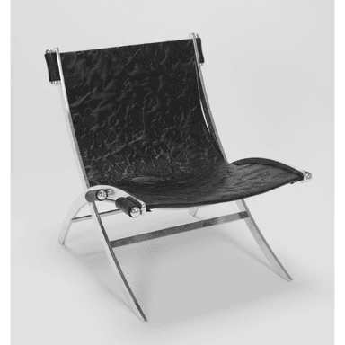 A modern lounge chair with a striking contemporary design. The chair features a polished chrome metal frame with a distinctive angular and curved structure, supporting a seat and backrest upholstered in black material with a textured, crinkled finish. The armrests consist of cylindrical black elements secured by chrome fixtures. — 3D model (AI enhanced source)