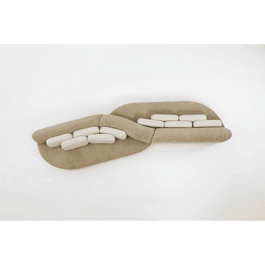 A contemporary curved modular sectional sofa featuring a beige upholstered base and lighter, off-white rectangular back cushions. The sofa consists of at least two large, organically shaped sections joined to form a fluid, undulating seating arrangement. — 3D model (AI enhanced source)