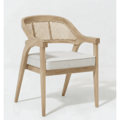 A light-toned wooden armchair featuring a curved cane backrest and a removable off-white upholstered seat cushion. The chair has a solid wood frame with straight legs and integrated armrests. — 3D model (AI enhanced source)