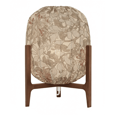 A Mid-Century Modern style table lamp featuring a spherical fabric shade adorned with a floral pattern in shades of beige, green, and muted red. The shade is supported by a tripod-style wooden base, likely teak, characterized by its warm brown tone and tapered legs with a connecting crossbar. — 3D model (AI enhanced source)