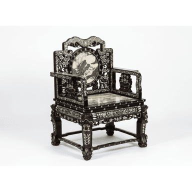 An antique East Asian armchair featuring a dark, carved hardwood frame extensively inlaid with iridescent mother-of-pearl. The chair has a square, polished marble seat with green and white veining. The backrest is ornate, topped with a shaped crest rail and a central circular panel depicting a landscape scene. The armrests and legs are also heavily decorated with floral and geometric mother-of-pearl inlay and intricate carving. — 3D model (AI enhanced source)