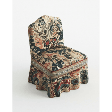 A fully upholstered chair with an elaborate floral and figural tapestry-style fabric, featuring a skirted base and no visible legs. — 3D model (AI enhanced source)