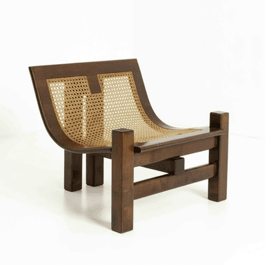 A low-profile lounge chair featuring a sturdy dark stained wooden frame with a curved backrest and seat, both intricately woven with natural cane. The chair exhibits a robust, almost brutalist aesthetic due to its thick, rectangular wooden elements for legs and frame, contrasting with the lighter, organic texture of the cane. — 3D model (AI enhanced source)