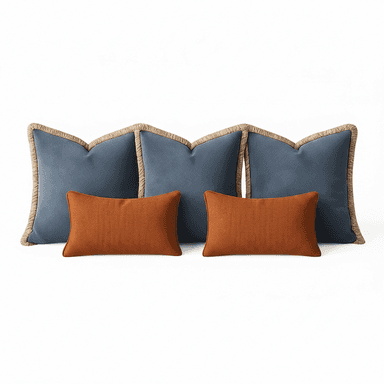 A set of four decorative pillows. Two larger pillows are a deep blue color with a textured weave and feature a decorative rope trim along their unique, scalloped edges. Two smaller, rectangular pillows are a burnt orange color with a prominent basketweave texture. All pillows appear to be filled and plump. — 3D model (AI enhanced source)